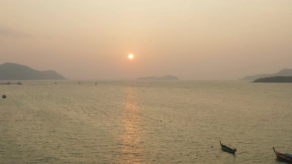 Aerial View Of The Sun Shining Over Fishing Boats