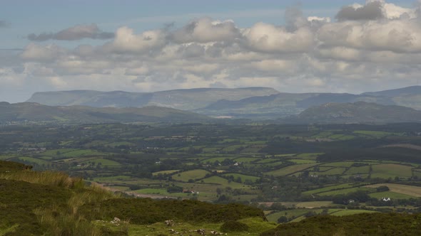 Time lapse of rural agricultural nature landscape during the day in Ireland. alt