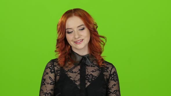 Girl Looks Around and Cute Smile. Green Screen. Close Up. Slow Motion