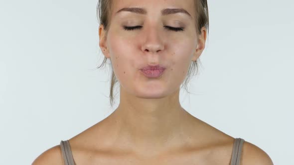 Flying Kiss, Close up of Kissing Beautiful Girl, White Background
