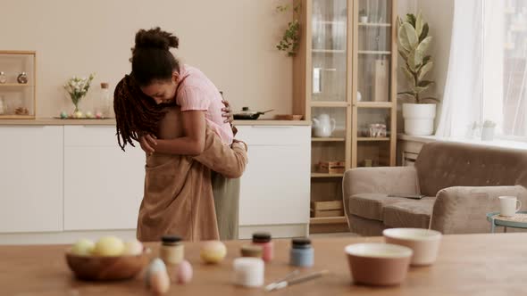 African Girl Hugging Mommy at Home