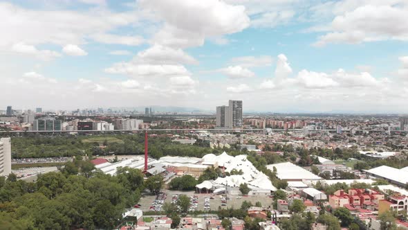 Aerial panoramic view of southern Mexico City, CDMX, drone is flying backwards with views to the nor