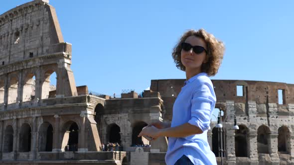 Young Female Traveler Taking Photo Of Famous Landmark Using Cell Phone. Trip To Europe.