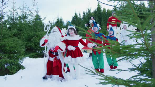 Santa Claus and his elves dancing