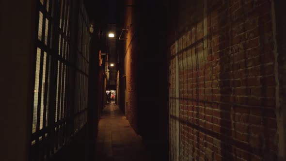 Narrow Dark Venetian Passageway Between Old Buildings