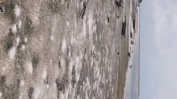 Vertical Video of Low Tide in the Ocean Near the Coast of Zanzibar Tanzania Aerial View