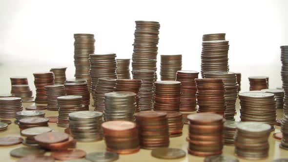 Stacks Of Coins Form Skyline alt