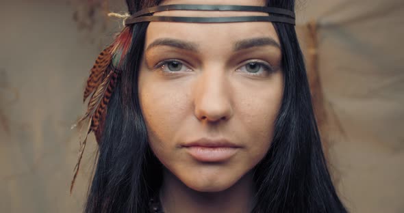 Young Native American Woman with Feathers in Her Hair, Looking, Portrait