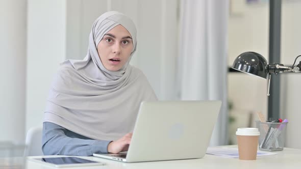 Young Arab Woman with Laptop Feeling Shocked