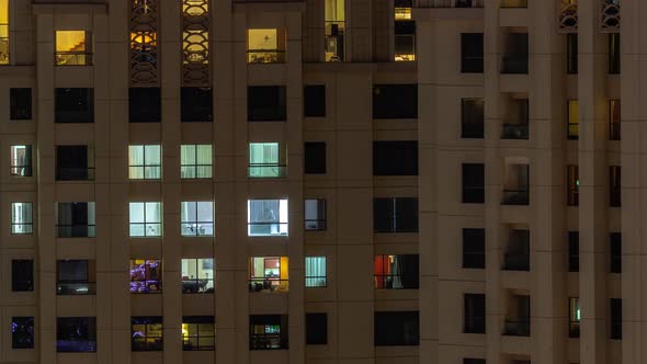 Evening View of Exterior Apartment Recidential Building Timelapse with Glowing Windows