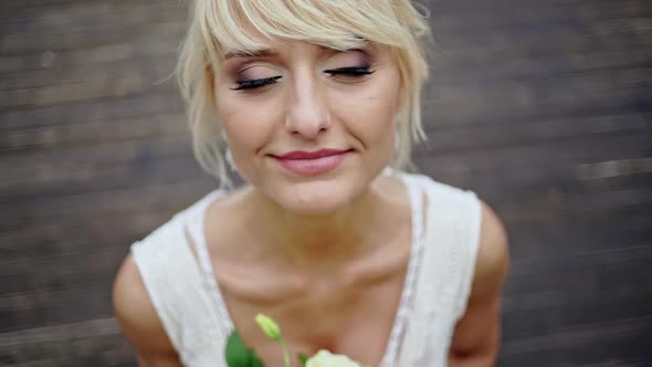 High View Portrait of Beautiful Happy Bride with Bouquet - Beautiful Makeup