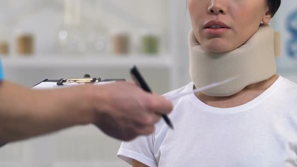 Doctor Giving Bill to Woman in Foam Cervical Collar, Expensive Treatment