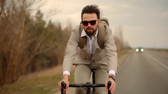 Businessman In Suit Riding On Bicycle.Trip To Work On Bike.Cyclist Businessman Hurry To Work.