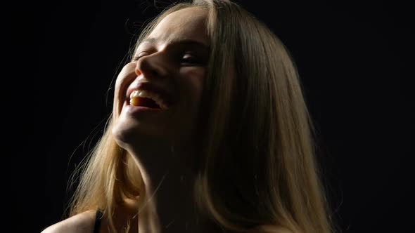 Joyful Beautiful Female Laughing, Isolated on Black Background, Femininity