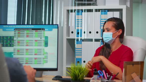 Entrepreneur with Mask Having Video Meeting