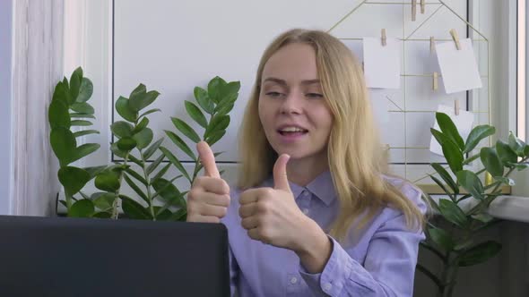 Young Woman Working on a Computer at Home