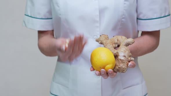 Nutritionist Doctor Healthy Lifestyle Concept - Holding Ginger Root, Lemon and Vitamin Pills