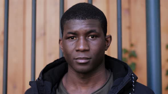 Confident serious attractive young african black man looking at camera