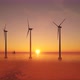 3D animation of offshore wind turbines at sunset. Wind Farm, renewable energy. - VideoHive Item for Sale