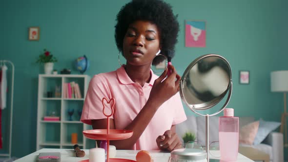 Young Woman Is Doing Makeup