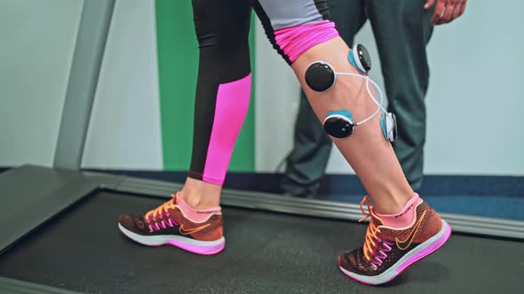 Young Woman Doing Exercises Under Physiotherapist Supervision