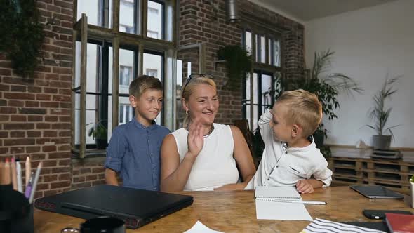 Teacher, Along with her Little Pupils, Rejoicing in the Completion of Lessons