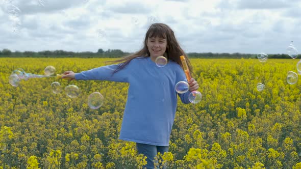 Child blow on soap bubble.