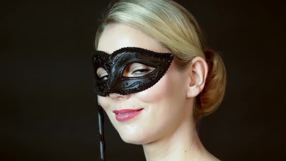 Young woman wearing costume mask