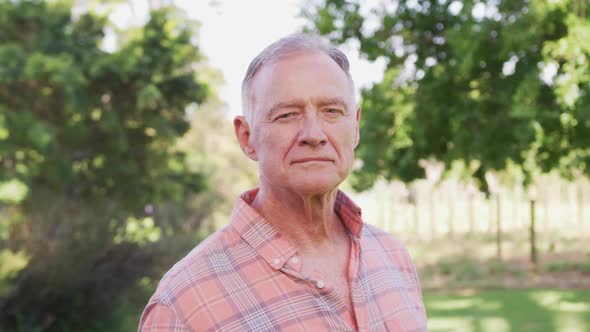 Portrait of a senior Caucasian attractive man spending time in his garden 