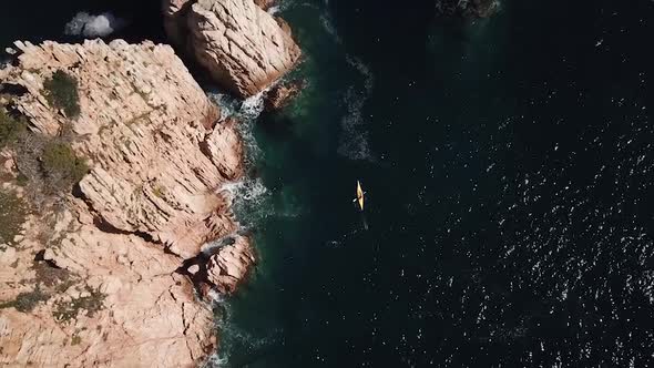 Flying above kayak, cliffs, waves and seagulls