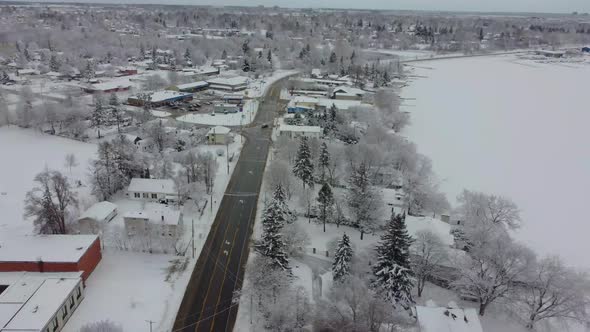 Aerial snow covered neighborhood during a overcast winter day