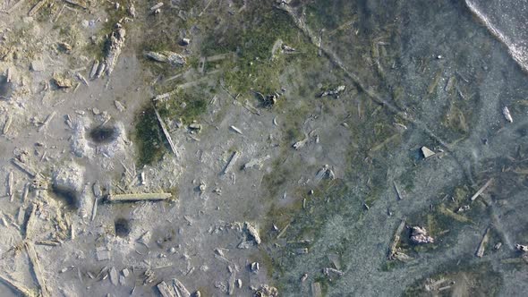 Aerial view sea wave hit coastal with abandoned wood