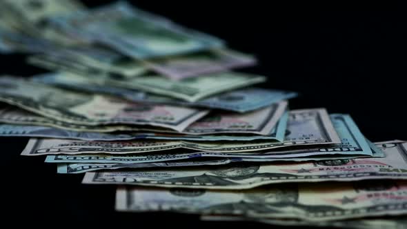United States Dollar Bills Thrown On Black Table. - studio, close up