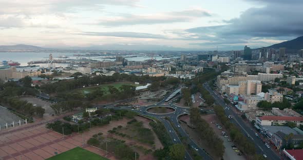 Wide Aerial Shot Tracking Forward Into the City of Cape Town During a Spectacular Sunset with Table