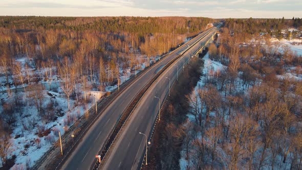 Magnificent Winter Landscape with a Road at Sunset Aerial View