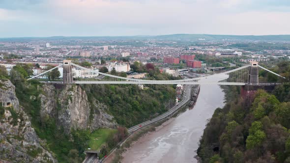 Dolly forward drone shot over the clifton suspension bridge towards central Bristol