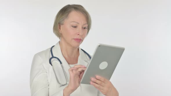 Old Female Doctor Using Digital Tablet on White Background