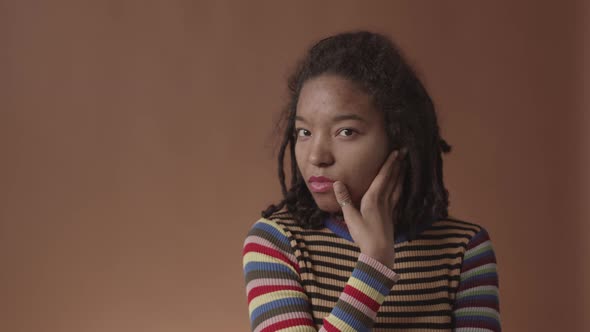 Portrait of Beautiful African-American Woman with Problem Skin