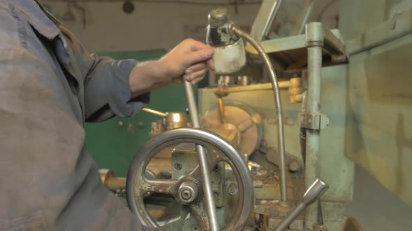 Hands working with a machinery