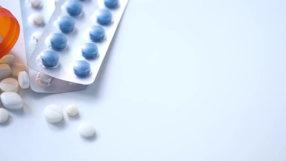 Close Up of Stack of Pills of Blister Packs on White Background 
