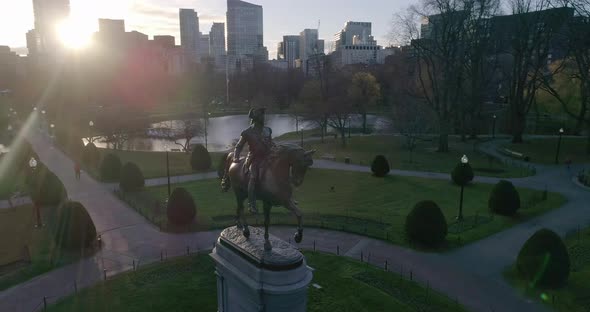 Aerial Pan Around George Washington Statue and Skyline at Sunset