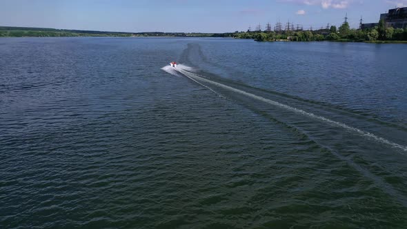 Motor boat on the river. High-speed boat on blue water surface
