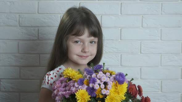 A Child with Colorful Flowers.