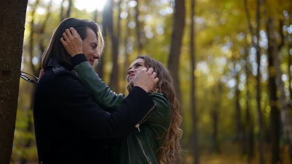 Romantic Date in Forest in Early Autumn Beautiful Woman and Her Boyfriend are Hugging