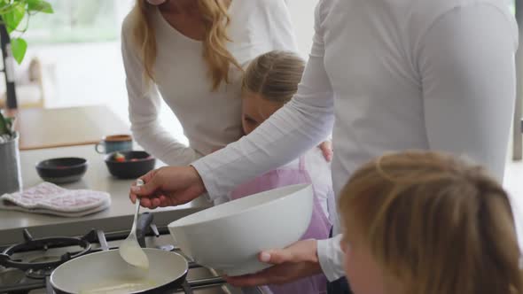 Family preparing food in kitchen at home 4k