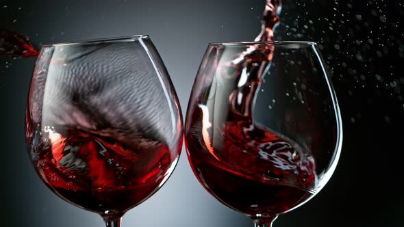 Super Slow Motion Shot of Clinking Two Glasses of Red Wine at 1000Fps