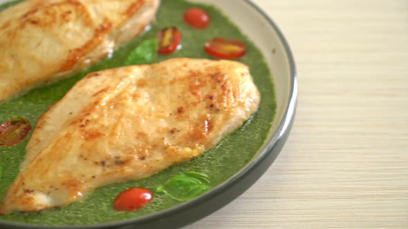 grilled chicken steak with pesto sauce and tomatoes