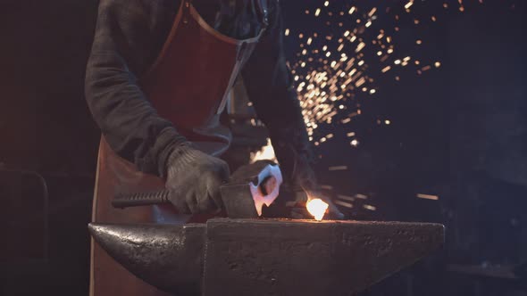 Closeup of Forging Hot Metal with Sparks