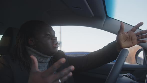 Portrait of African American Black Man Driver Cauth in the Traffic Jam