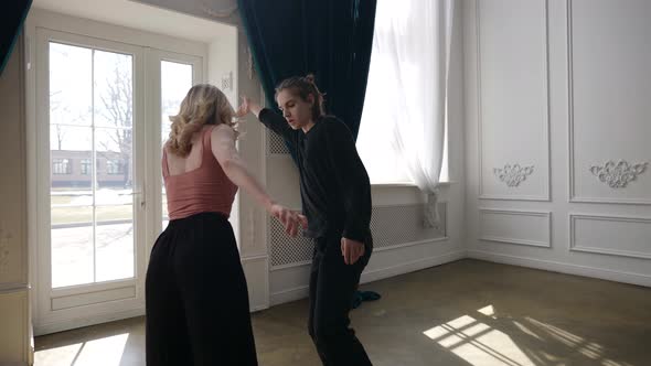 a Young Couple is Dancing in a Spacious Bright Room